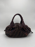 FENDI ZUCCA SPY. Brown textured handbag with a logo on a light gray background